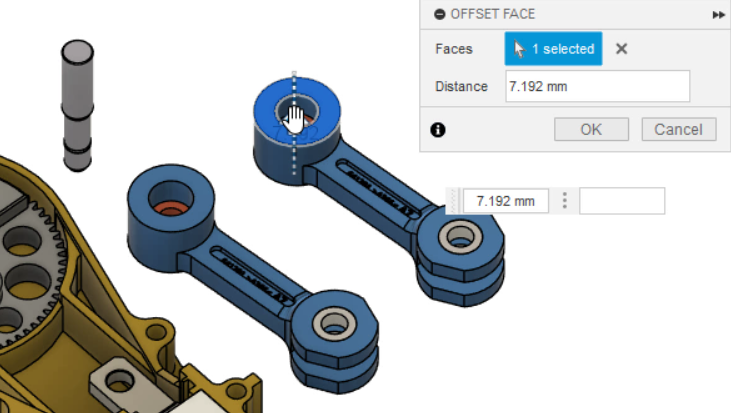 On the canvas, with the original and duplicate connecting rods side by side, dragging to offset the face of one instance shows the same change on the other.