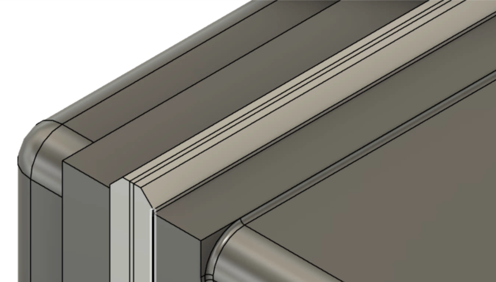 In a zoomed-in view of the vise assembly, the jaw plates passing through each other at the fully closed extent.