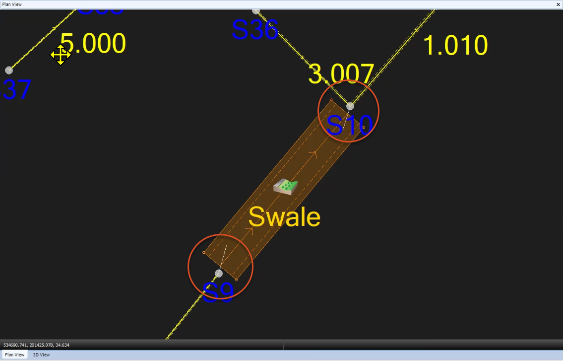 A closeup of the swale, with the imported CAD pipes showing and highlighted in red circles.