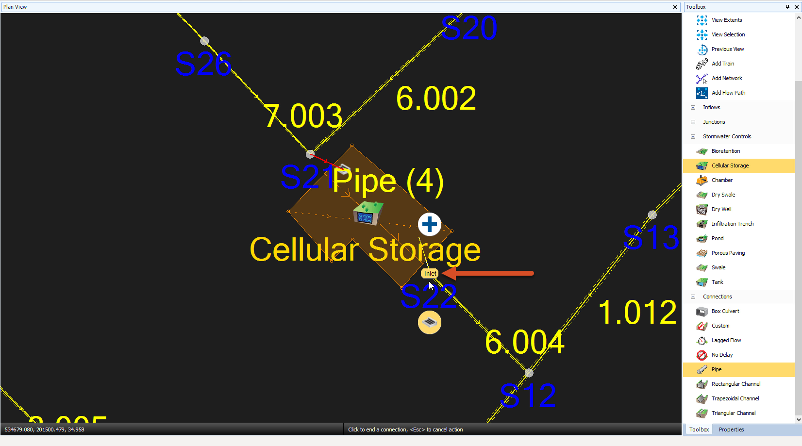 The Plan View and the Toolbox. The cellular storage object is showing the upstream inlet created and highlighted, and the downstream outlet is in the process of being created. A callout draws attention to the label “Inlet” in the model, which must be showing when the user clicks, to ensure the correct outlet object is created.