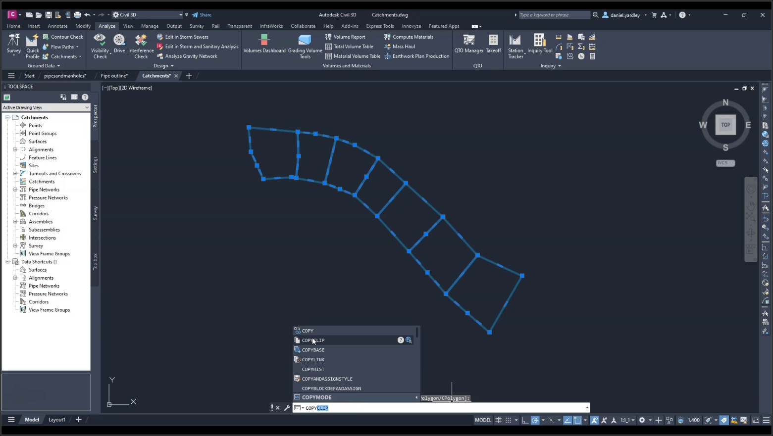 The Civil 3D interface, with the files pipesandmanholes.dwg and Catchments.dwg open, and the catchment objects highlighted as selected and being copied in Catchments.dwg.