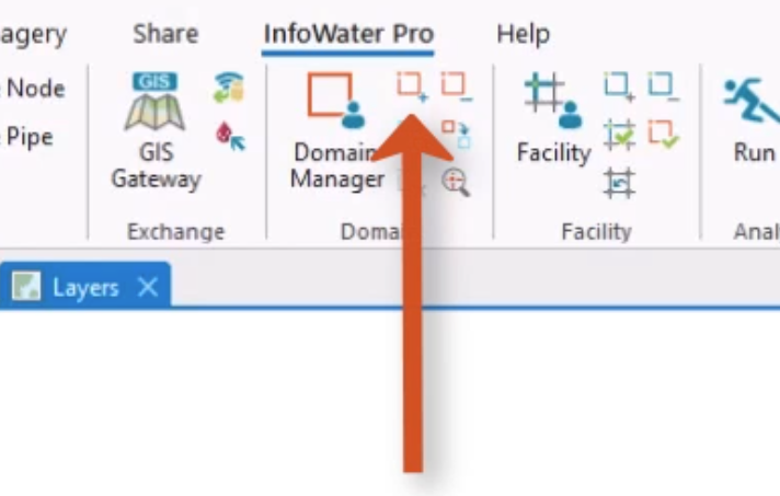 In the InfoWater Pro ribbon, Domain panel, the Enlarge Domain button called out with a red arrow.