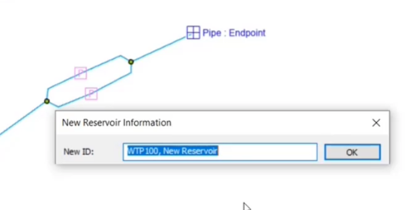 Screenshot of the map with two pumps and a reservoir placed, the Information dialog box is displayed, and the reservoir ID is being entered