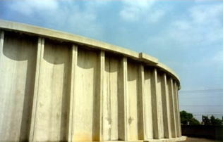 A stock image of an older municipal water storage tank.