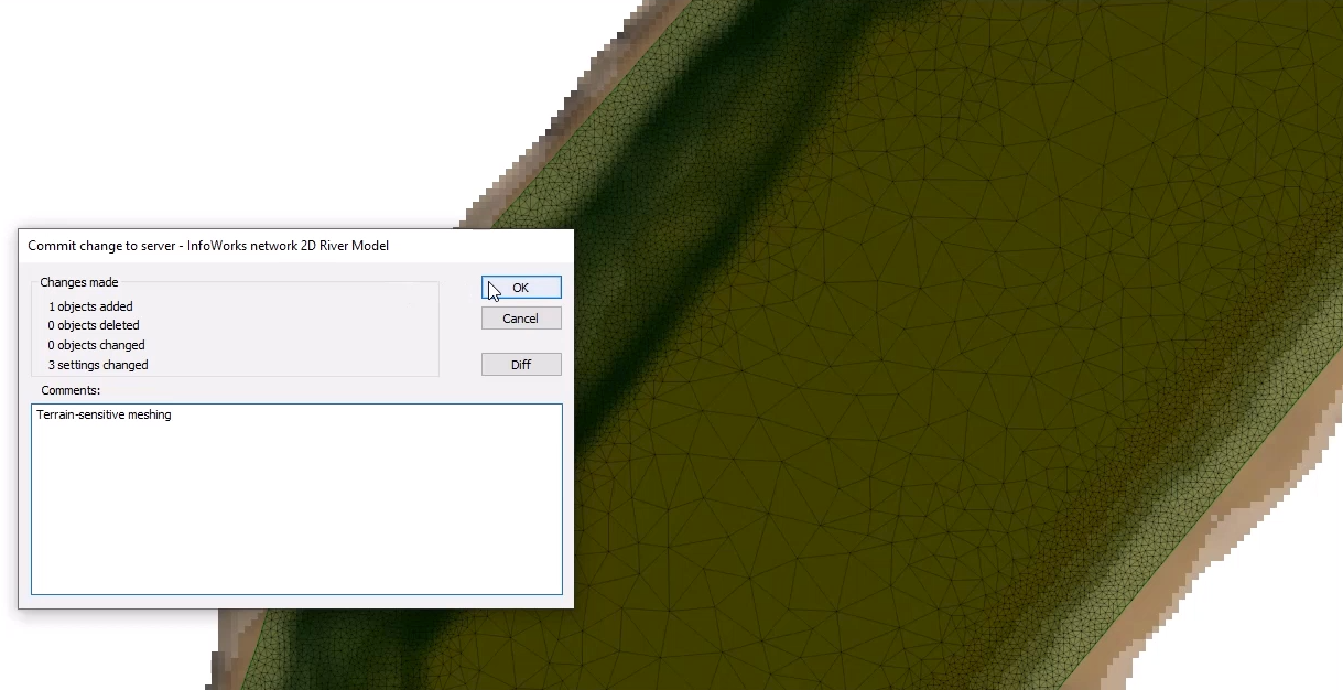 In the Commit change to server popup, the comment “Terrain-sensitive meshing” entered and OK selected, and in the GeoPlan, the 2D zone with the terrain-meshing represented by areas of very small triangles, especially along the steep sides of the channel.
