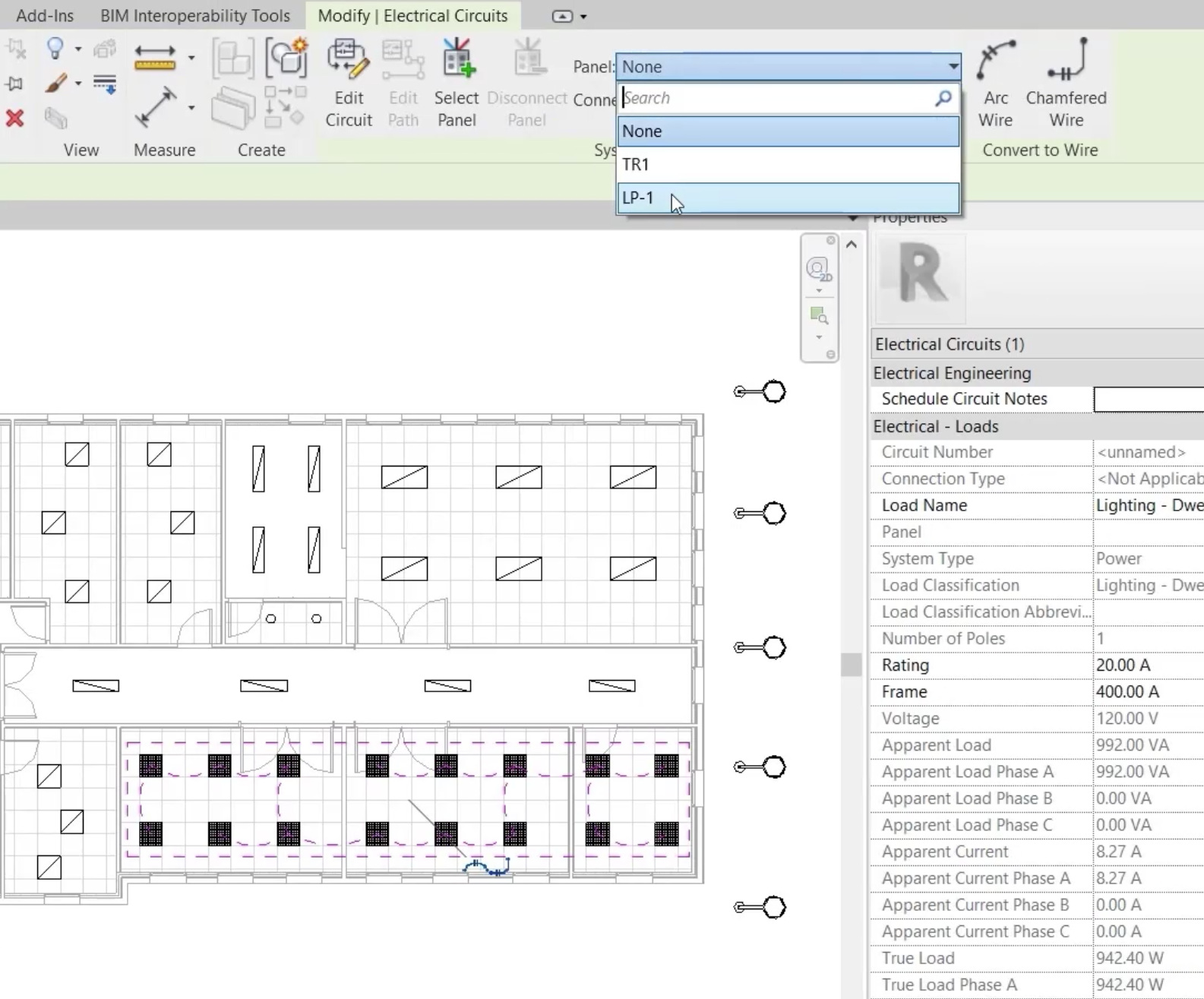 In the ceiling plan, the new lighting fixtures are selected, and in the Panel drop-down, LP-1 is selected.